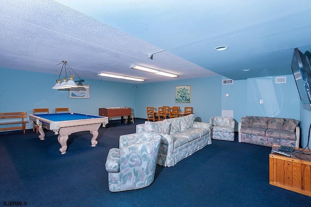 game room with a textured ceiling, pool table, and dark colored carpet