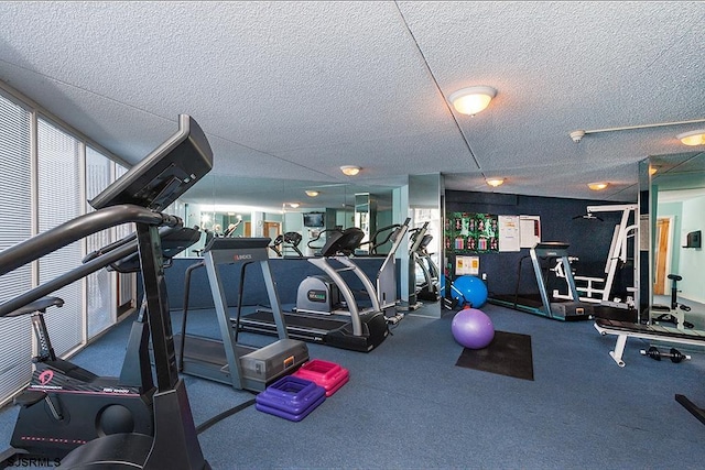 workout area featuring a textured ceiling