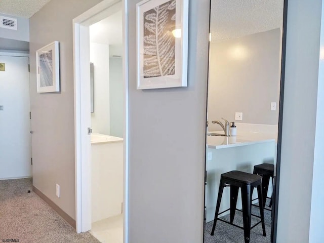 bathroom featuring a textured ceiling