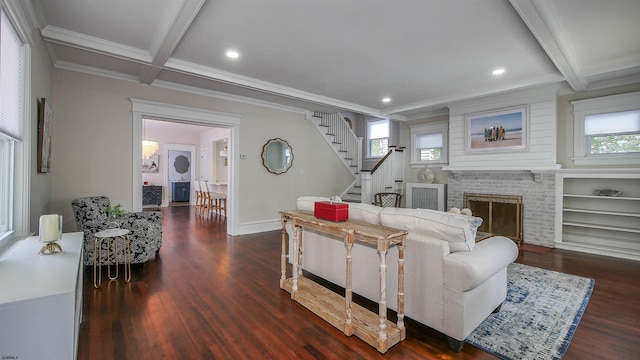 living room with dark wood-type flooring, beamed ceiling, and a healthy amount of sunlight