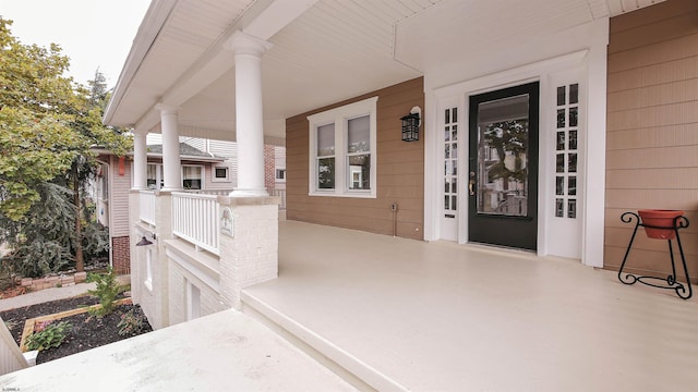 entrance to property featuring a porch