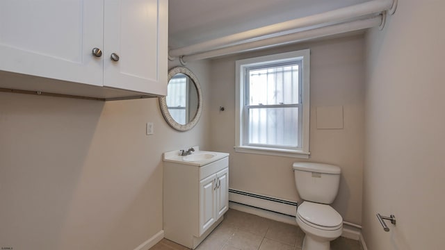 bathroom with vanity, baseboard heating, toilet, and tile patterned floors