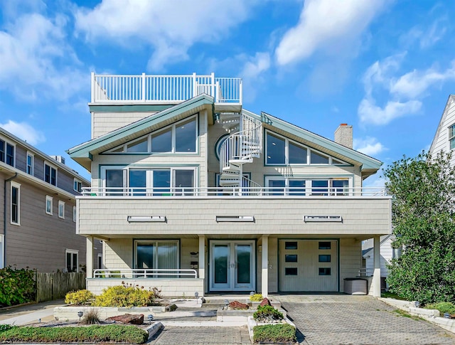 view of front of house featuring a porch and a balcony