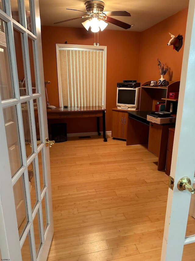 kitchen featuring french doors, light hardwood / wood-style flooring, and ceiling fan