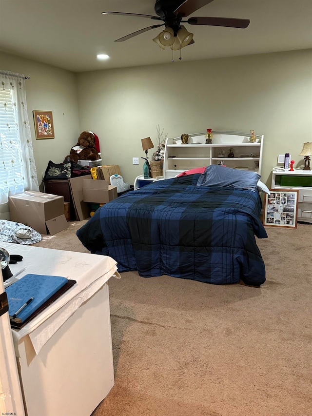 bedroom featuring ceiling fan and carpet floors