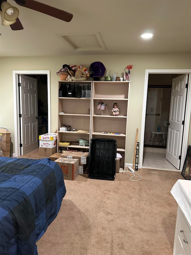 bedroom featuring light colored carpet and ceiling fan