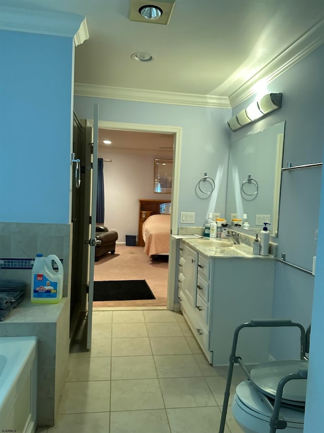 bathroom featuring ornamental molding, tile patterned floors, and vanity