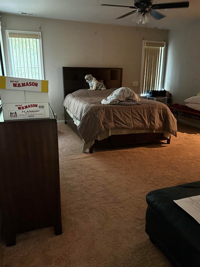 carpeted bedroom featuring ceiling fan