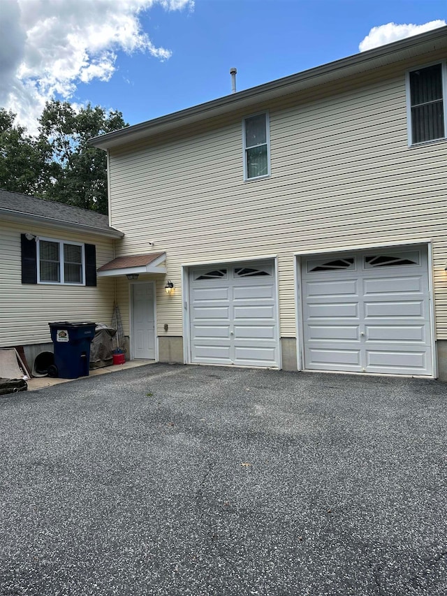 exterior space with a garage