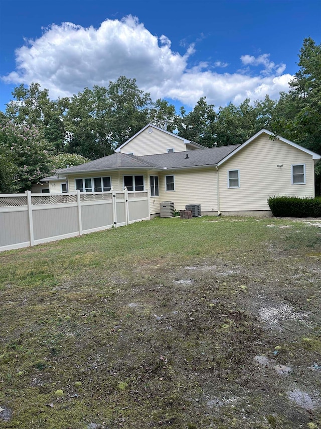 rear view of house with cooling unit