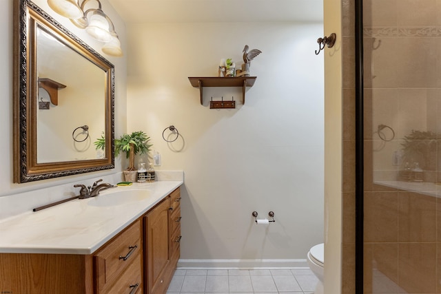 bathroom with tile patterned floors, a shower with shower door, vanity, and toilet