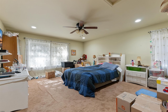 carpeted bedroom featuring ceiling fan