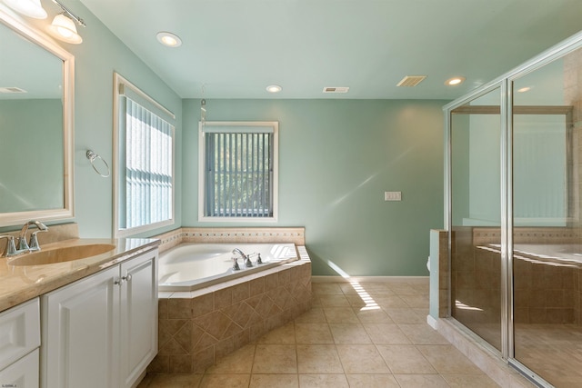 bathroom featuring tile patterned floors, vanity, and independent shower and bath