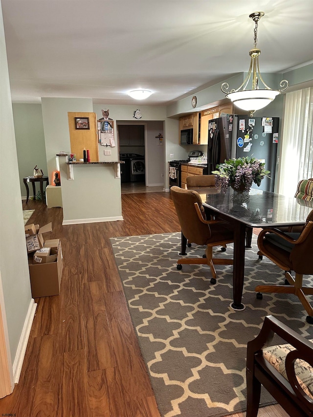 dining room with dark wood-type flooring