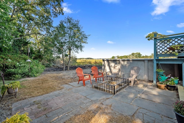 view of patio / terrace with a fire pit