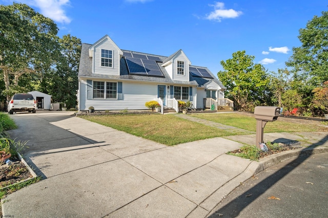 new england style home featuring a front yard