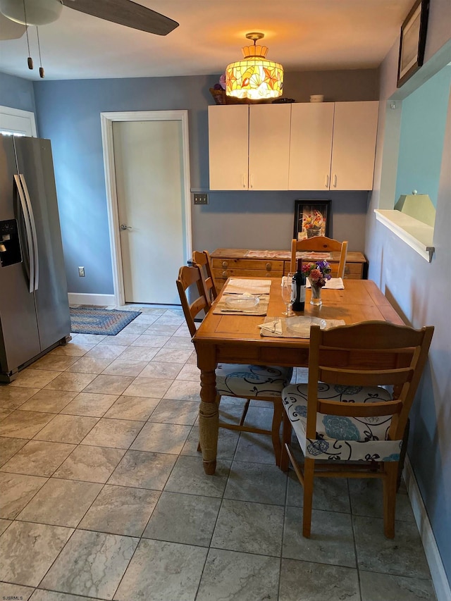 dining area with ceiling fan