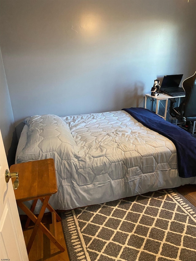 bedroom featuring hardwood / wood-style flooring