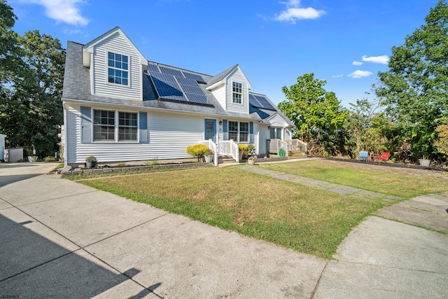 new england style home featuring a front lawn