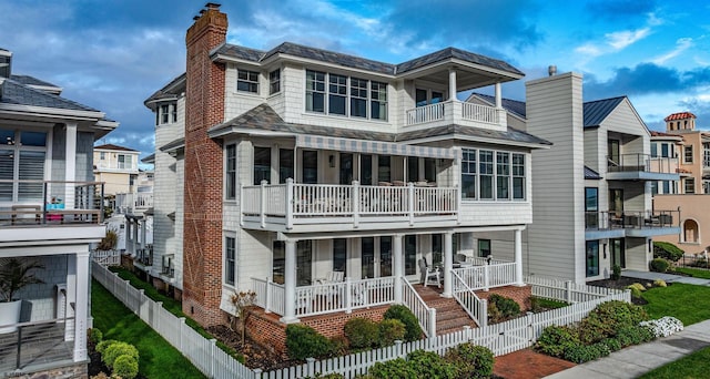 109 S 11th Ave, Longport, NJ 08403 - view of front facade featuring a balcony and a chimney