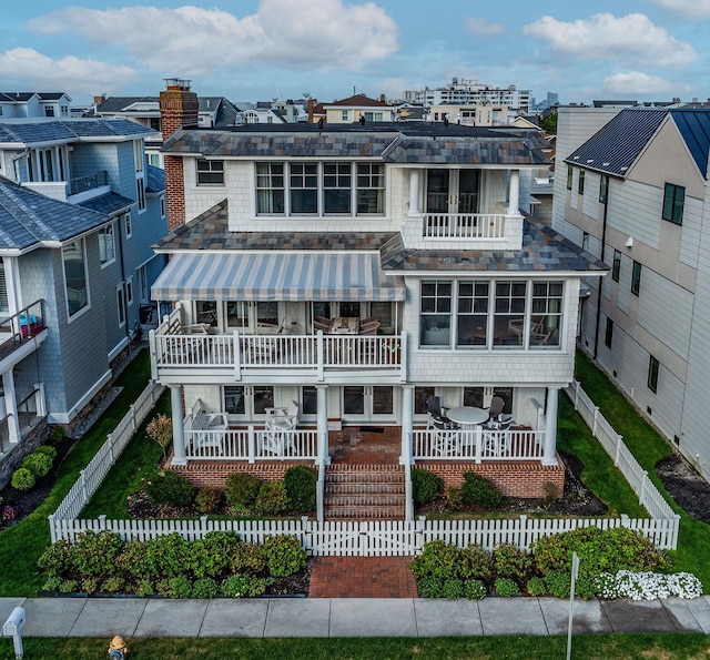 back of house with a balcony