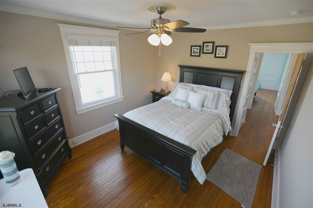 bedroom with dark wood-type flooring, ornamental molding, and ceiling fan