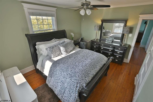 bedroom with ceiling fan, crown molding, and dark hardwood / wood-style flooring