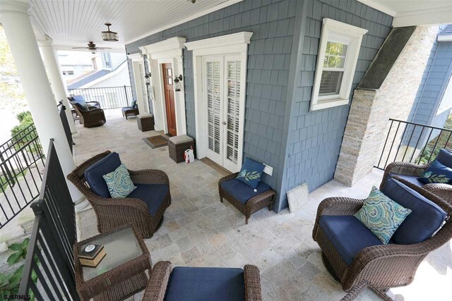 view of patio featuring ceiling fan and outdoor lounge area