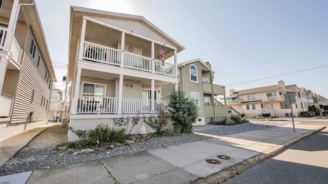 view of front of home with a balcony and covered porch