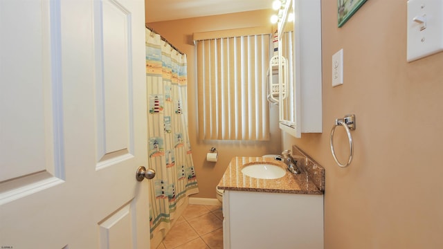 bathroom featuring walk in shower, tile patterned floors, and vanity