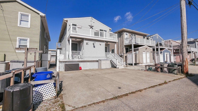 back of house with a balcony