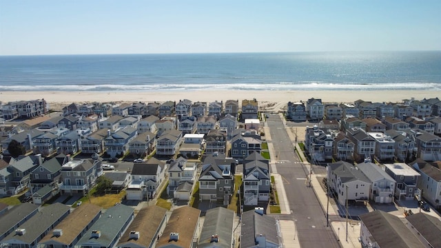 bird's eye view with a water view and a view of the beach