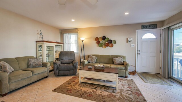 living room featuring plenty of natural light and light tile patterned floors