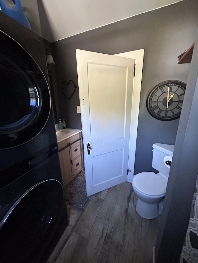 bathroom with hardwood / wood-style floors, toilet, and vanity