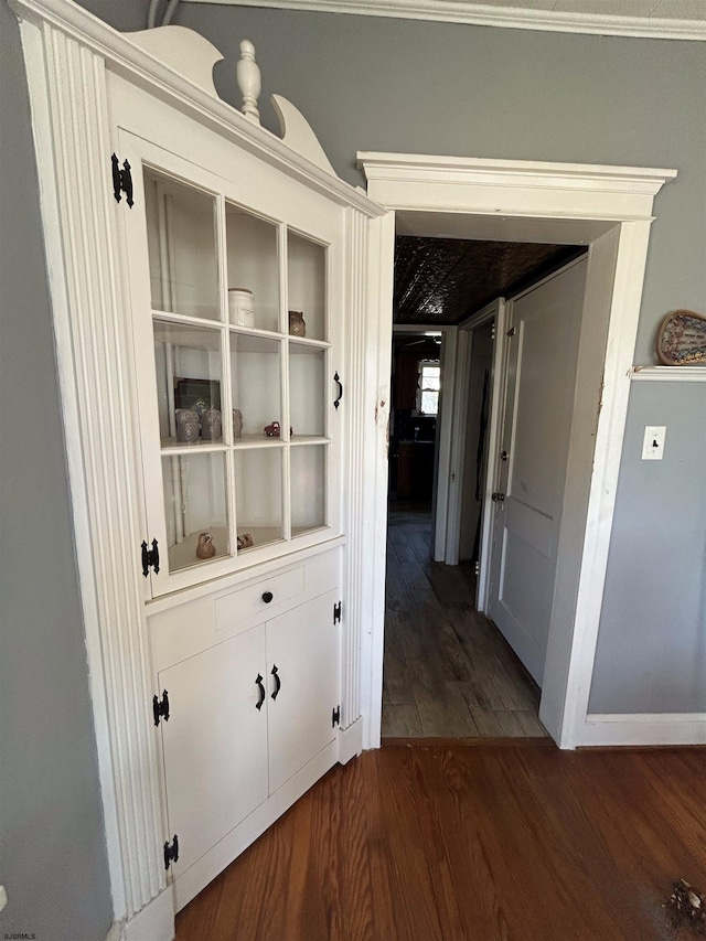 hallway with dark wood-type flooring