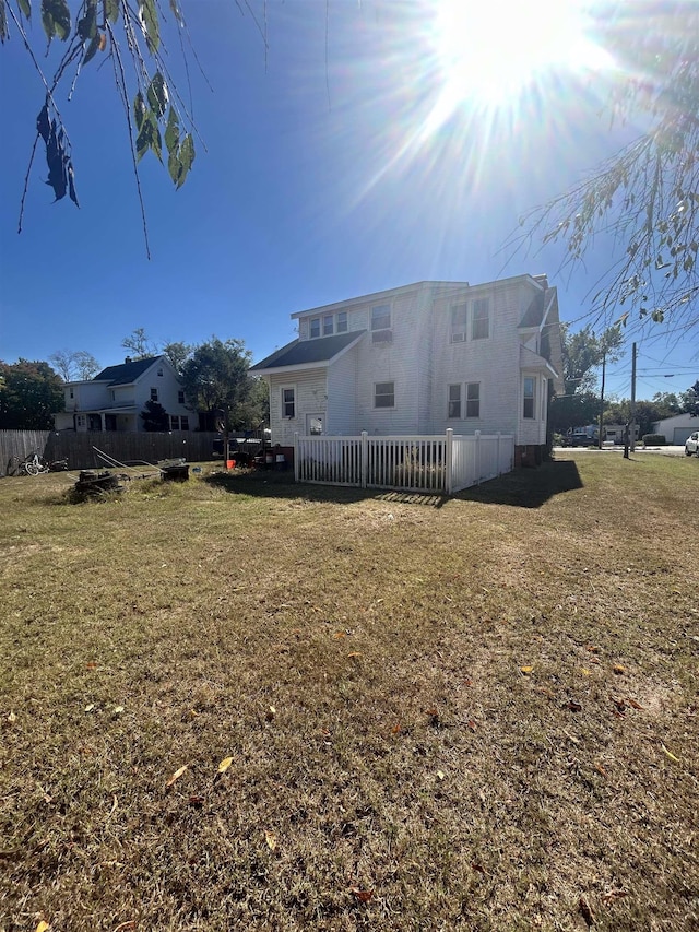 rear view of house with a lawn