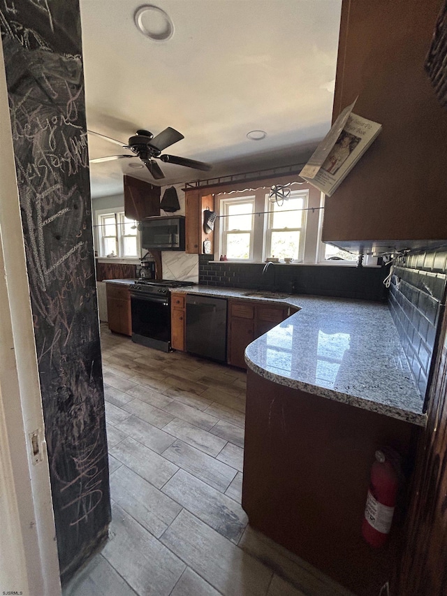 kitchen featuring black appliances, ceiling fan, decorative backsplash, sink, and light hardwood / wood-style floors