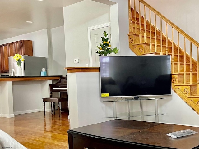 living room with light hardwood / wood-style flooring