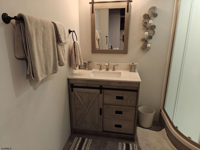 bathroom with vanity and an enclosed shower