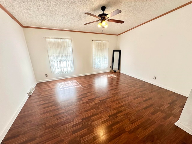 empty room with a textured ceiling, dark hardwood / wood-style floors, and ceiling fan