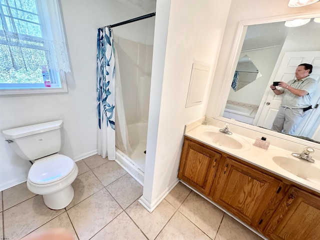 bathroom featuring tile patterned flooring, vanity, toilet, and a shower with shower curtain