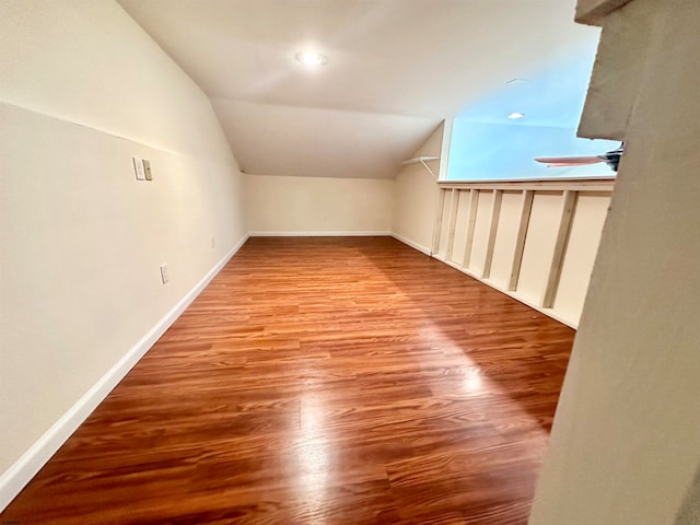 bonus room featuring lofted ceiling and light wood-type flooring