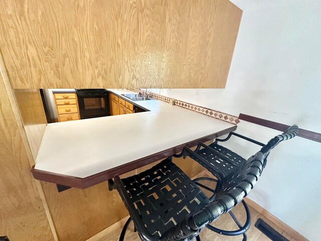 interior space featuring light wood-type flooring and sink