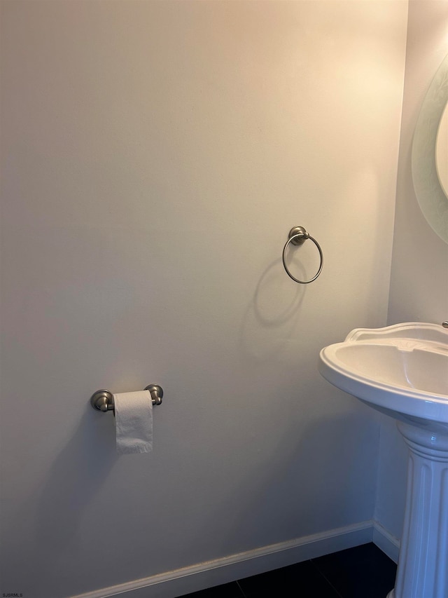 bathroom with tile patterned floors