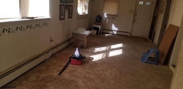 unfurnished room featuring a baseboard radiator