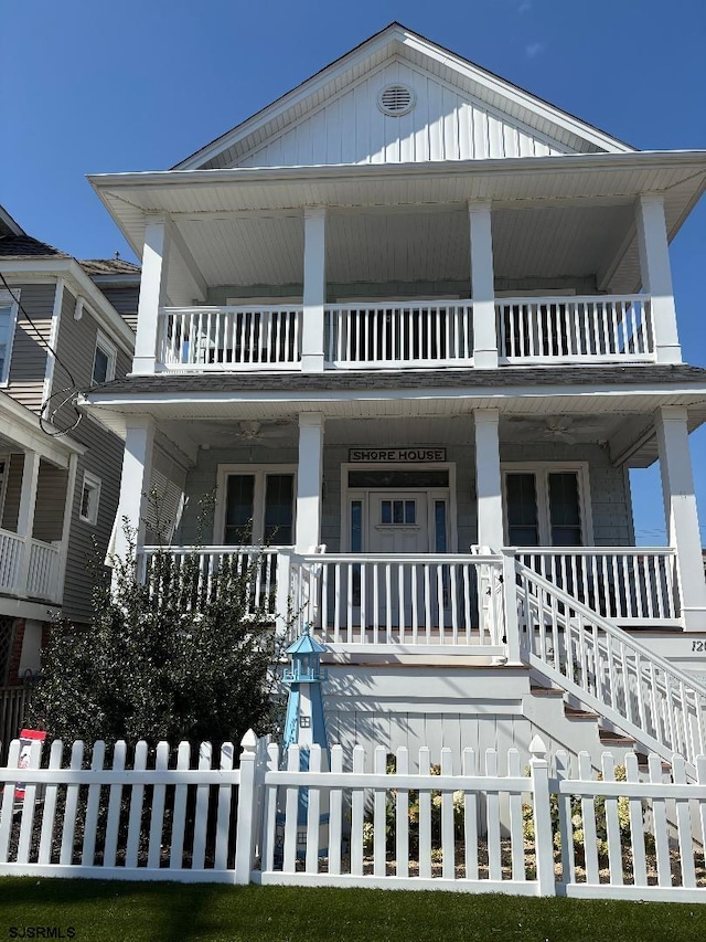 view of front of property featuring a porch and a balcony