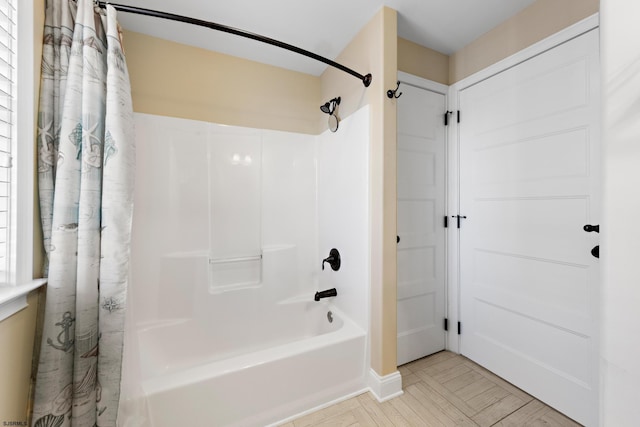 bathroom with shower / bathtub combination with curtain