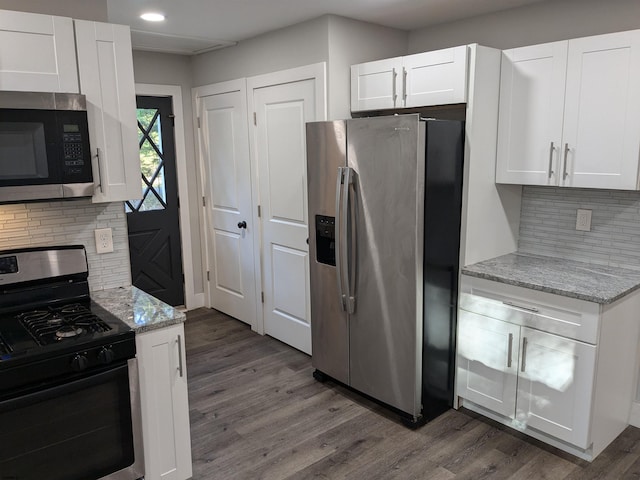 2406 Oslo Ave, Mays Landing, NJ 08330 - kitchen featuring appliances with stainless steel finishes, white cabinetry, dark wood-style flooring, tasteful backsplash, and recessed lighting