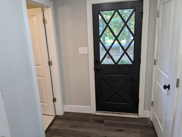 doorway to outside with dark wood-type flooring