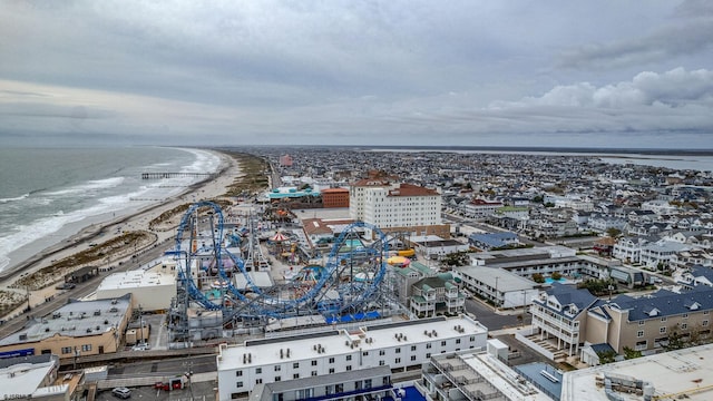 bird's eye view with a water view and a view of the beach